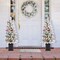 Set of 2 4ft Pre-Lit Flocked Artificial Christmas Porch Trees with and Red Berries and 60 Warm White/Multi-color Lights,2 function w/Foot Pedal